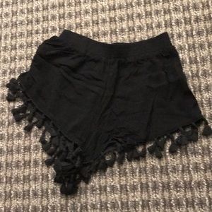 black festival shorts with tassels